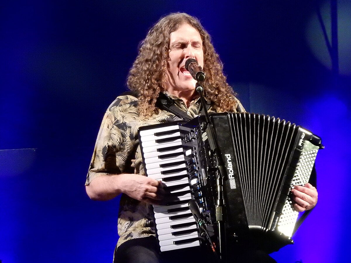 Musician Weird Al Yankovic playing an accordion at the Apollo